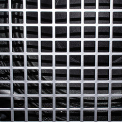 Black part of subwoofer close up