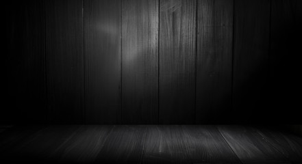 Wooden table with dark blurred background design