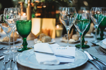 Wedding table set up with glasses and plates 