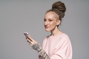 Portrait of an attractive young woman with dreadlocks