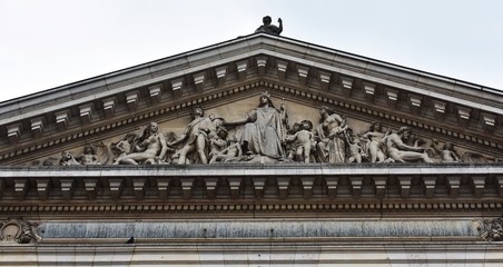 Details architecture on the exterior of the former Brussels Stock Exchange building on the Place de la Bourse in Brussels, Belgium.