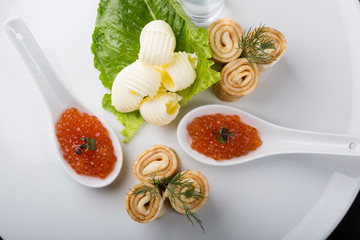 Vodka shot with red caviar