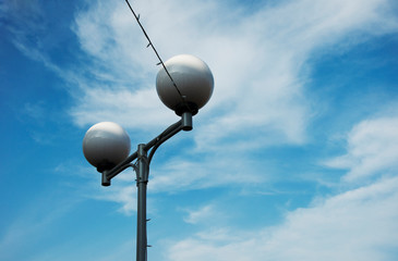 Street lamp on blue sky background