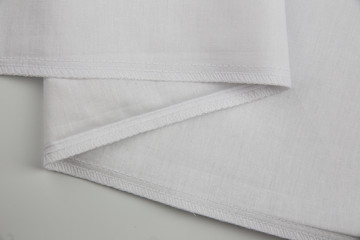 stitch and seam with a closed section on a cotton white fabric