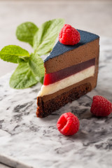 Piece of chocolate mousse cake with raspberries