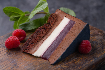 Piece of chocolate mousse cake with raspberries
