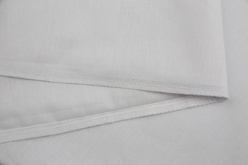 stitch and seam with a closed section on a cotton white fabric