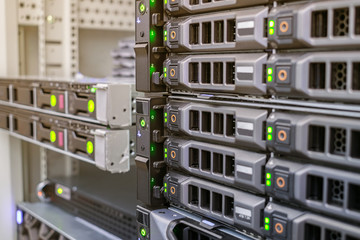 Computer equipment works in the server room. Powerful data servers are in the racks of the data...