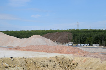 Construction of new road and transport interchange. Work on reinforced concrete structures and road...