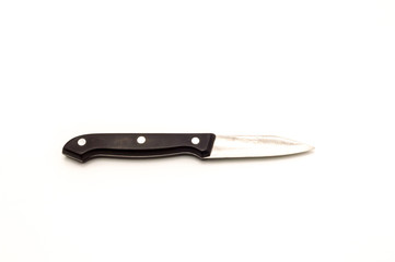 A small knife spins with a black wooden handle