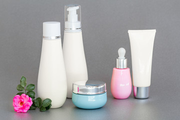 blank bottle packaging with natural cosmetic cream, serum, skincare, lotion, tonic. bio organic product on gray background. spa concept. Cosmetic design template. Plastic bottle label design