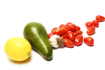 ingredients for homemade guacamole on white