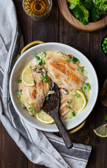 chicken breast with cream sauce and broccoli