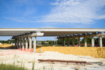 Construction of new road and transport interchange. Work on reinforced concrete structures and road...