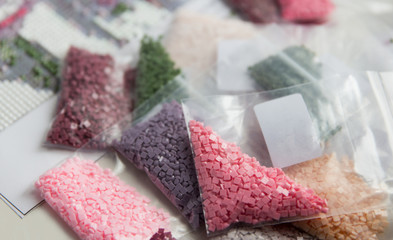 Multicolored diamond strases for handmade process of creation of diamond painting 3d