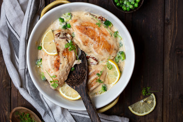 chicken breast with cream sauce and broccoli