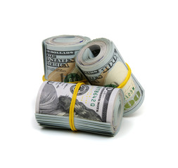 dollar bills knitted by a  rubber band isolated on white background
