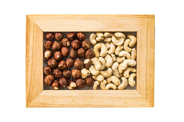 nuts in a photo frame isolate on a white background