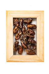 dates dried fruits in a frame for a photo isolate on a white background