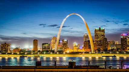 Downtown St Louis MO with the Old Courthouse and the Gateway Arch at sunset