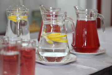 Water with lemon and juice lemonade. This drink combines the delicious flavors of cranberry and together with water.