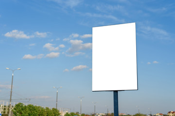 Outdoor advertising poster against the sky.