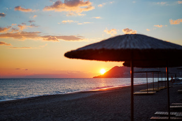 Beautiful landscape. Traveling by Turkey. Sea Beach with sunloungers and umbrellas.