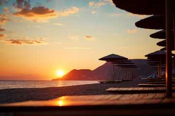 Beautiful landscape. Traveling by Turkey. Sea Beach with sunloungers and umbrellas.