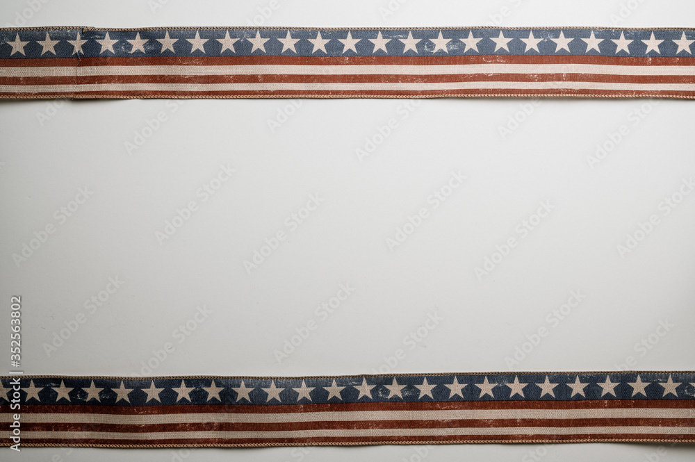 Wall mural American stars and stripes flat lay over rustic wood background 4th of July memorial day in Americana style