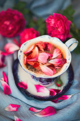 Selective focus old vintage ceramic cup of tea with flowers. Elegance and romantic table ware.