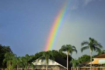 Rainbow over suburban in residential neighborhood Florida USA after the storm