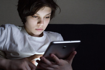 Portrait of a boy with a tablet