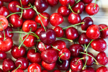 Ripe red cherry heap background close up