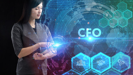 Business, Technology, Internet and network concept. Young businessman working on a virtual screen of the future and sees the inscription: CFO