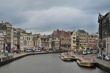 Amsterdam, Netherlands - June, 28, 2013: Bank of the canal in the historical part of the city