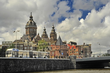 Fototapeta premium Amsterdam, Netherlands - June, 28, 2013: Bank of the canal in the historical part of the city