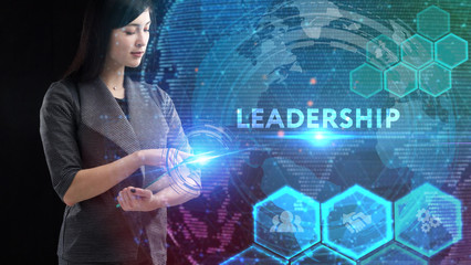 Business, Technology, Internet and network concept. Young businessman working on a virtual screen of the future and sees the inscription: Leadership