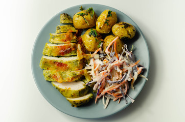 Pesto and mozzarella chicken breast fillet with herby baby potatoes and creamy coleslaw salad