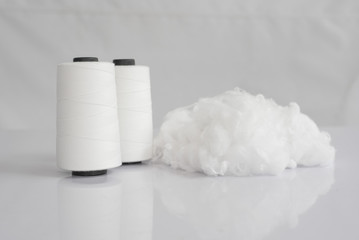 Polyester stable fiber & Raw White Polyester FDY Yarn spool with white background