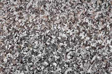 The texture of the marble chips. Grey, black and brown stone. Close up