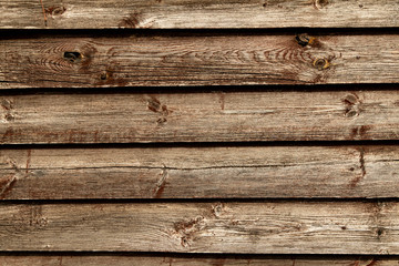 Old brown wooden wall background texture close up