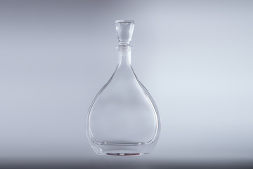Bottle in the form of drops on a white background