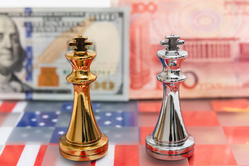 Chess pieces on USA and China national flag with banknote background