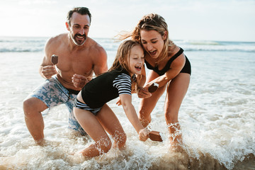 Family enjoying beach summer vacation