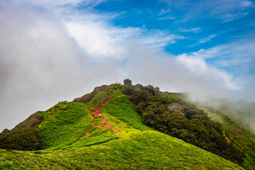 mountain with green grass and amazing sky