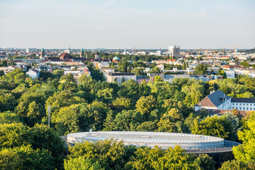 Panoramic city view of Berlin, viewfrom the top of the Berlin Victory Column in Tiergarten, Berlin, with modern skylines and green forest.