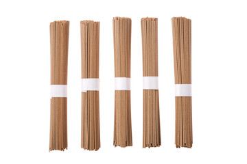 Dry soba buckwheat noodles isolated on white background