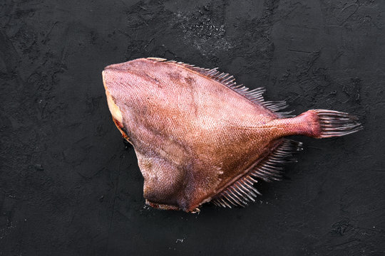Raw crimson sea bream on black background
