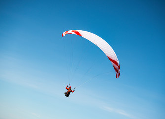 Paragliding in a blue sky