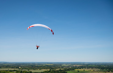 Paragliding in a blue sky